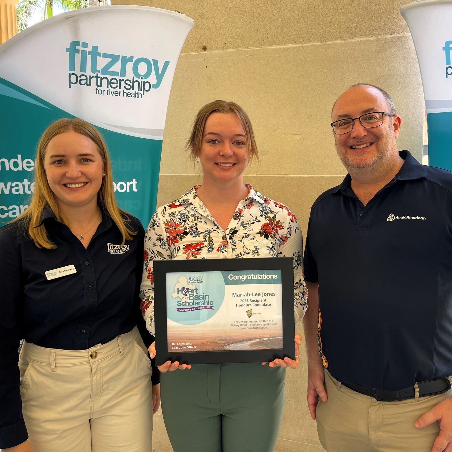 Ms Mariah-Lee Jones (middle) is presented with her HeART of the Basin Scholarship.